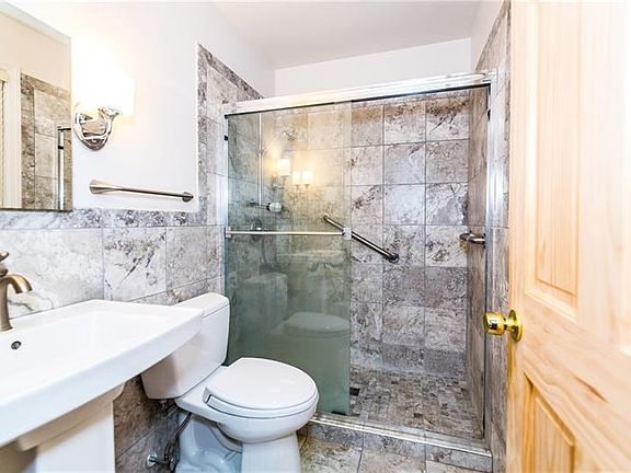 Renovated master bath with quality materials.