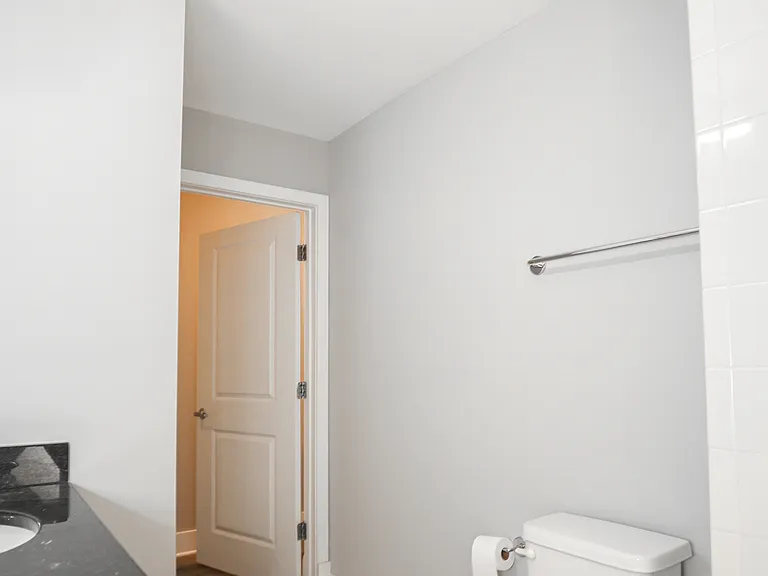 Clean Modern Bathroom with Extra Storage and Bright Lighting