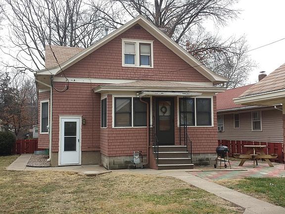 Rear of home showing basement entrance