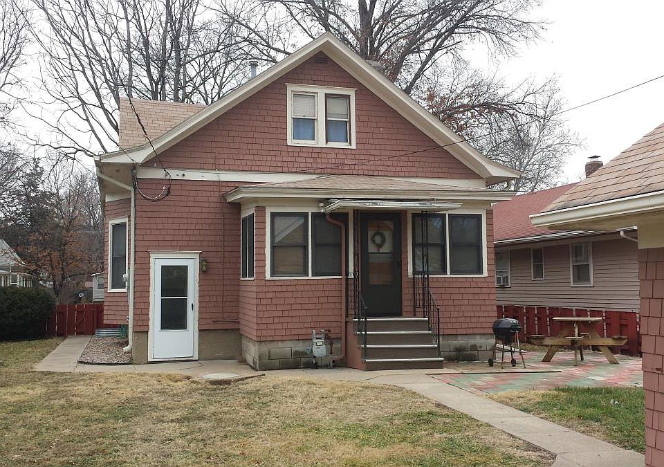 Rear of home showing basement entrance