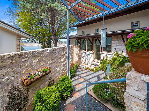 Side entrance to main house that leads you into the kitchen or following the path down to pool #1