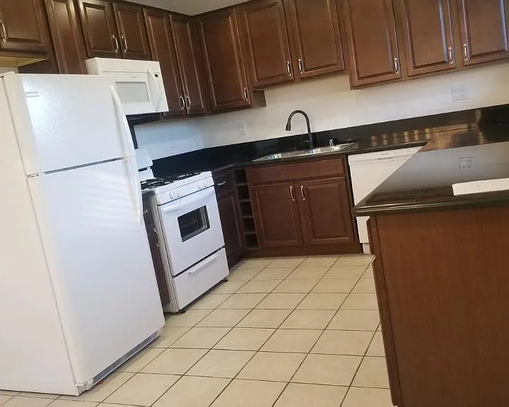 REMODELED KITCHEN WITH ALL NEW APPLIANCES, INCLUDING REFRIGERATOR, MICROWAVE, STOVE AND DISHWASHER