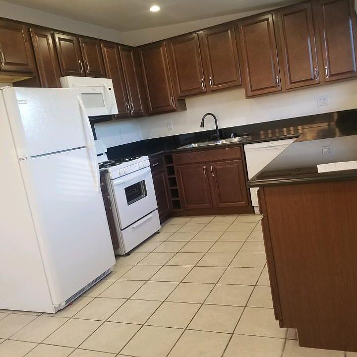REMODELED KITCHEN WITH ALL NEW APPLIANCES, INCLUDING REFRIGERATOR, MICROWAVE, STOVE AND DISHWASHER