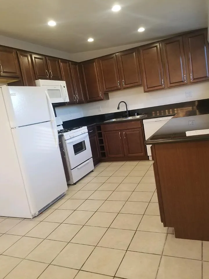 REMODELED KITCHEN WITH ALL NEW APPLIANCES, INCLUDING REFRIGERATOR, MICROWAVE, STOVE AND DISHWASHER - 621 S Wilton Pl #205