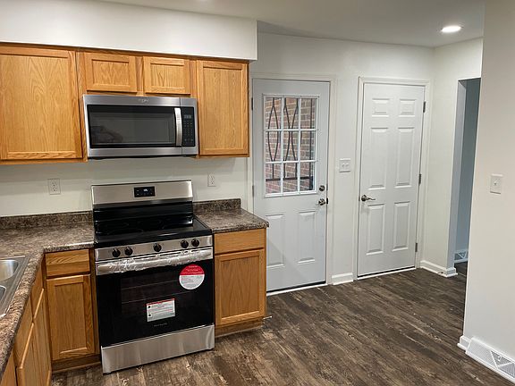 New stove, new microwave and new back door into the back yard.