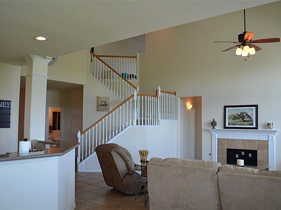 Master bedroom is through the door way by the fireplace.