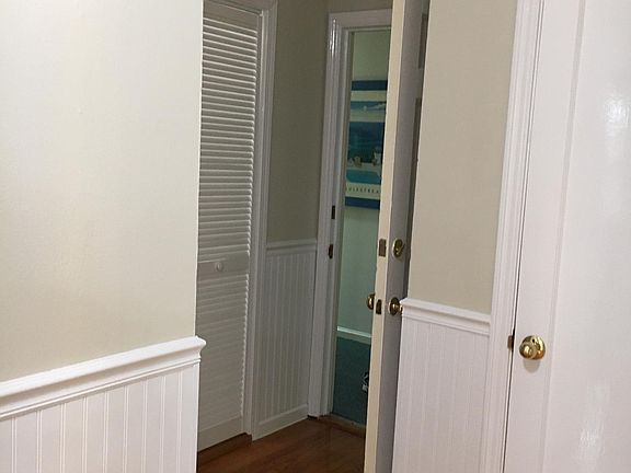 Entrance to apartment with small office/storage on your right as you enter and a linen closet on your right as you exit the front door