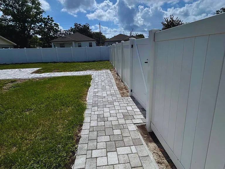 Private outdoor area with fenced access and walking path