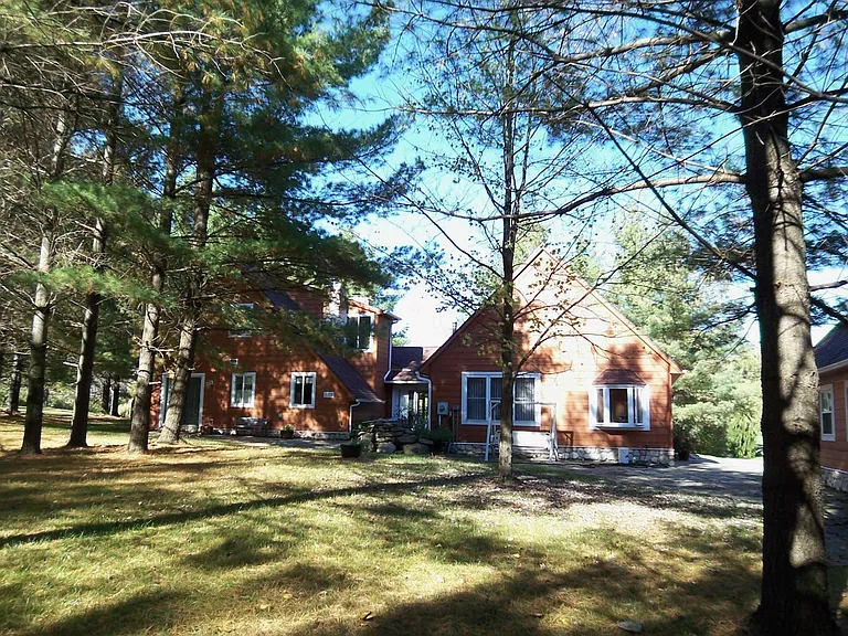 Rear view of house in fall.