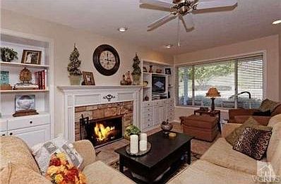 Beautiful expanded and customized Family room with custom fireplace and Mantel built -in media center
