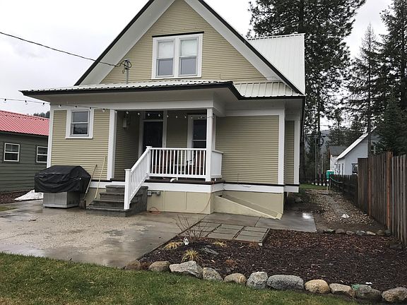 Backyard with patio, lawn with automatic sprinklers, shed for storage, two more
Parking places.
