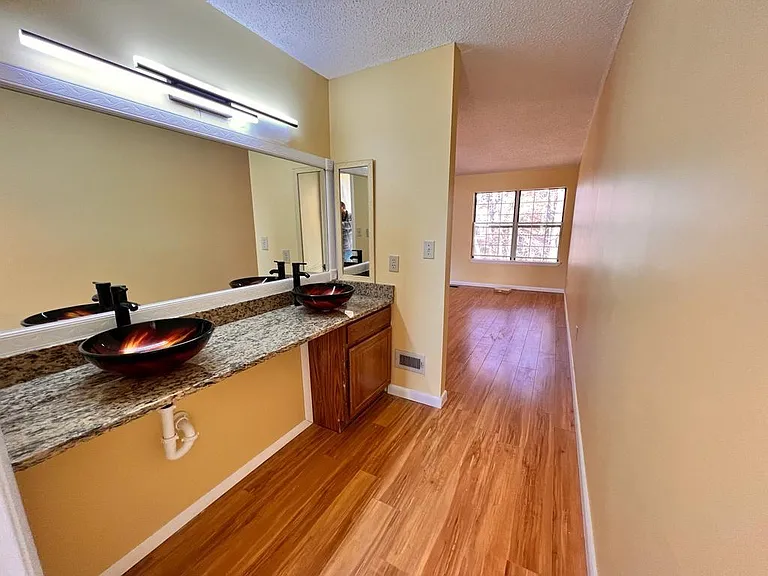 dressing area with double sink master bedroom