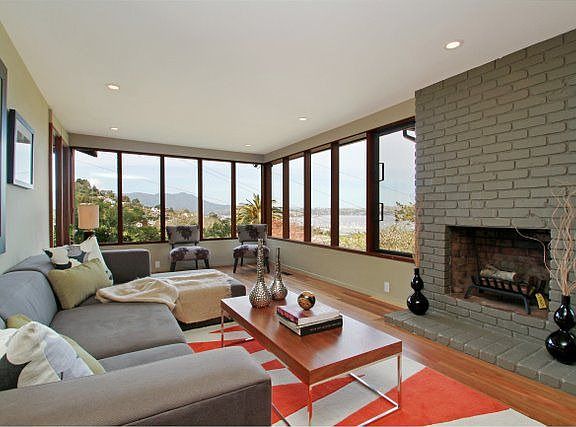 Formal living includes walls of glass with striking views of the Bay & Mt Tam