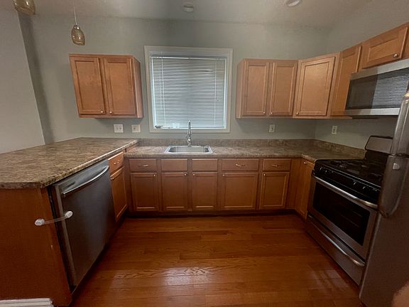 Kitchen with stainless steel appliances, including: Fridge, Range, Microwave, and Dishwasher. Lots of cabinet space and great lighting.