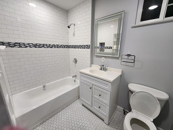 Brand new bathroom with mirror lighting