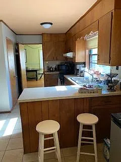 Kitchen 
Door on far left is the large pantry closet
New counter top coming soon with extended to for bar stool seating