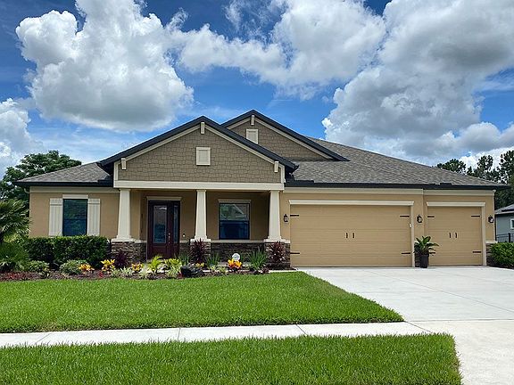 Joyce craftsman with opt stone new home front exterior William Ryan Homes Tampa