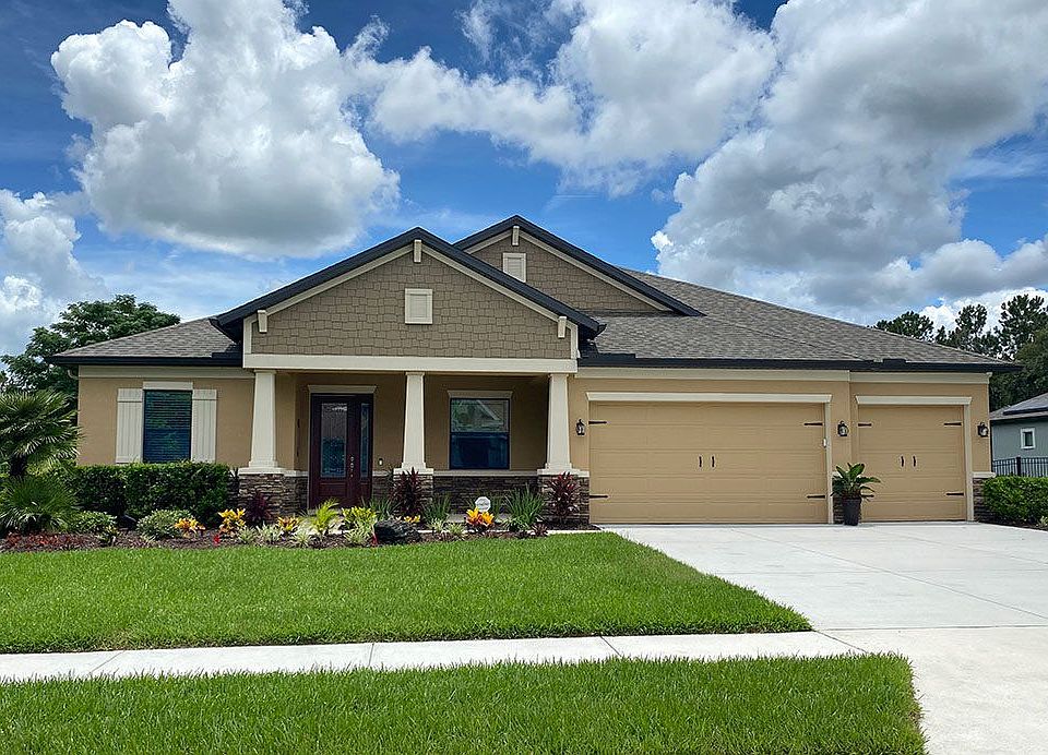 Joyce craftsman with opt stone new home front exterior William Ryan Homes Tampa