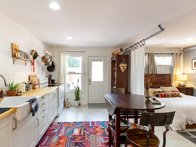 2 car garage size studio apt. Current tenants use this space as 4th bedroom. Could be additional living, office, workout
