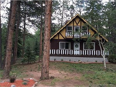 Adorable and rare modified chalet style home nestled amongst the