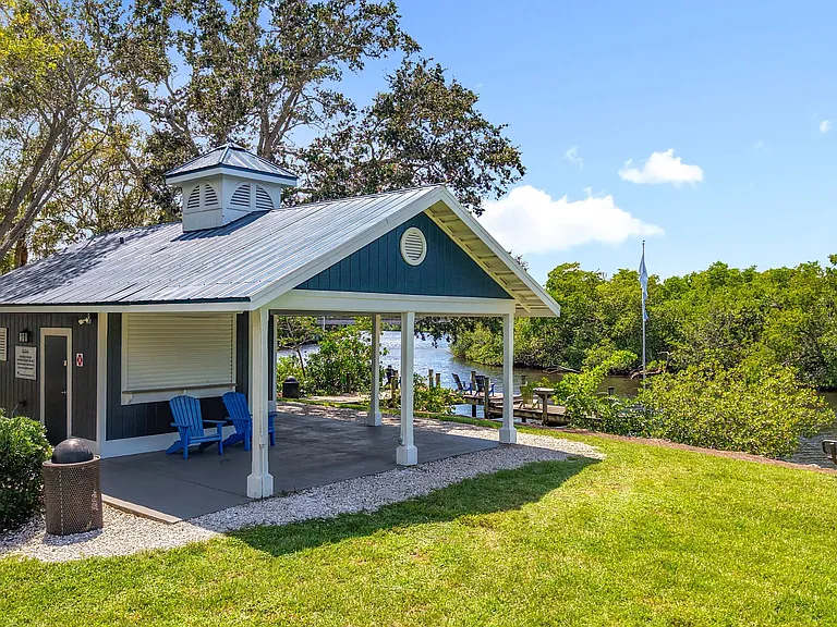 This scenic waterfront retreat at River Reach offers the perfect spot to relax, read, or connect with neighbors.