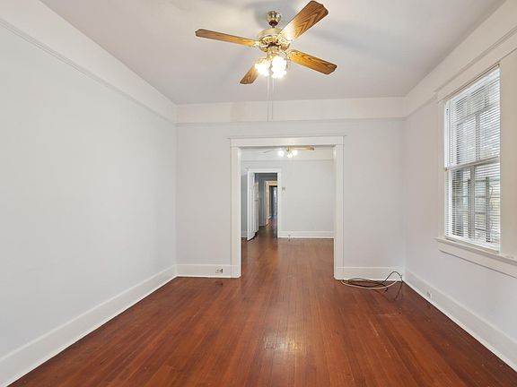 Large window and beautiful hardwood floors throughout