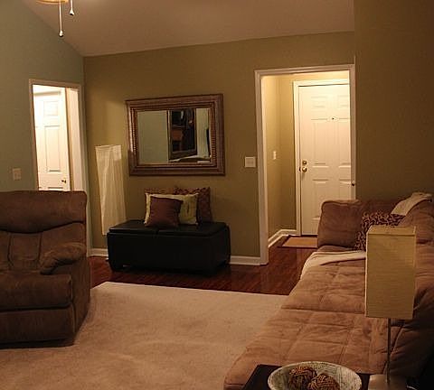 Living room view showing the front entry 