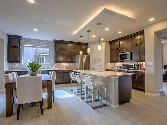 Kitchen accent ceiling over the island adds a modern touch as well as plenty of overhead lighting wi