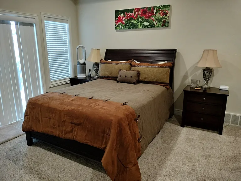 Master bedroom features a new Kingsdown queen bed, Smart TV, walk in closet, private walk-out deck with attached hot tub and pergola (to be installed before move-in). Enjoy luxury, privacy, and mountain views in this spacious retreat.