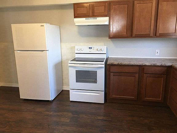 Newly renovated kitchen with all new appliances (refrigerator, electric oven/stove, dishwasher, countertop, cabinets, sink, and floor)