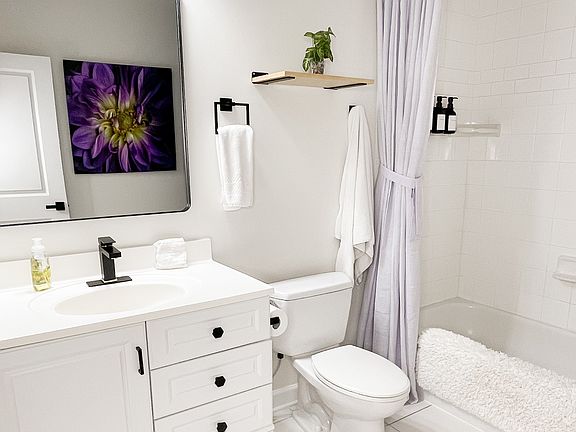 Spacious tub and shower for daily comfort.