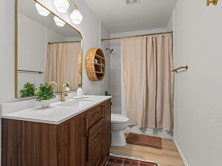Shared Bathroom with Separate Storage Closet