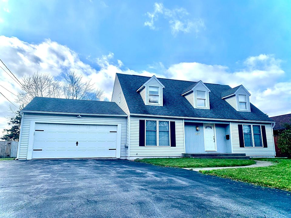 Front of house has over-sized two car garage, sitting patio, exterior lights, and ample off-street parking.