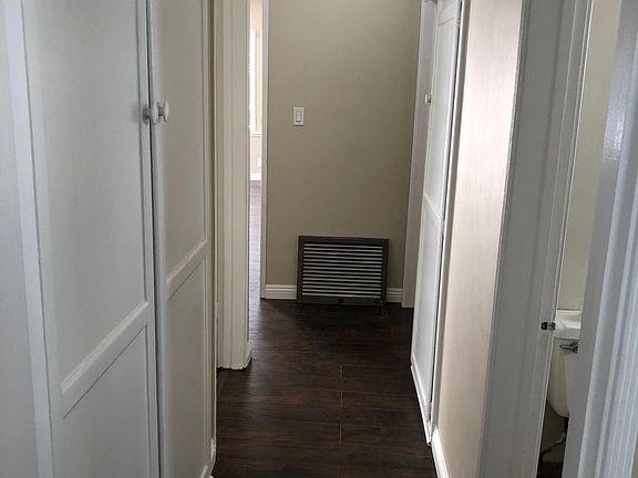 Hallway with plenty of storage and linen cabinet