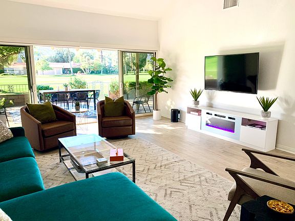 Living room flows into patio for indoor/outdoor living.