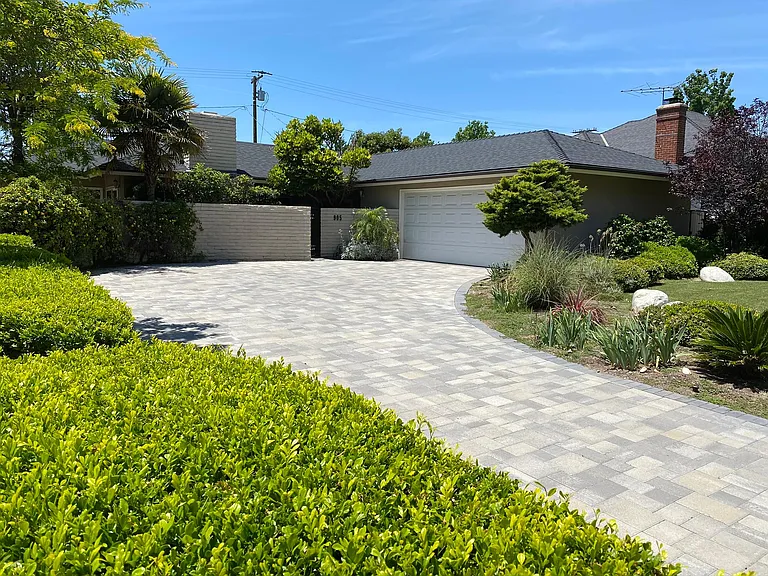 Large two car garage with plentiful storage. Connected to home through covered breezeway.