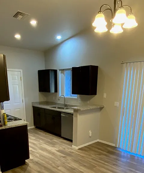 Picture of other unit. Flooring in unit for rent is plank shaped tile.