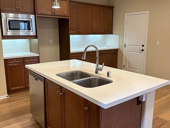 Quartz Countertops, dishwasher, and built-in microwave