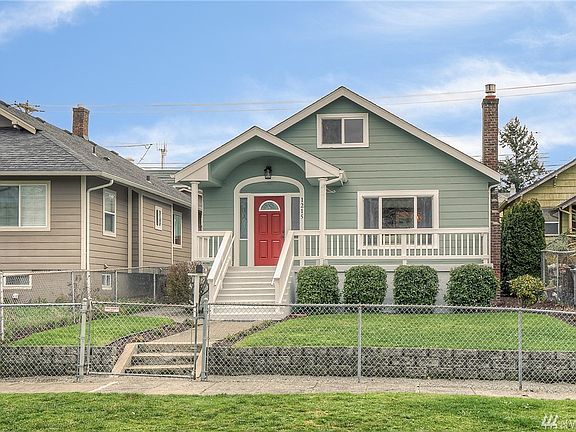 A picture of good taste and neatness, the freshly painted residence is surrounded by a well manicured fenced yard.