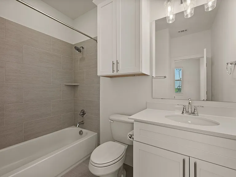 Bedroom #2 en suite full bathroom with shower and tub