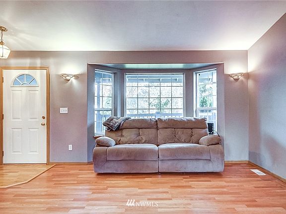 As you enter the home, your first stop is the light and bright living room.