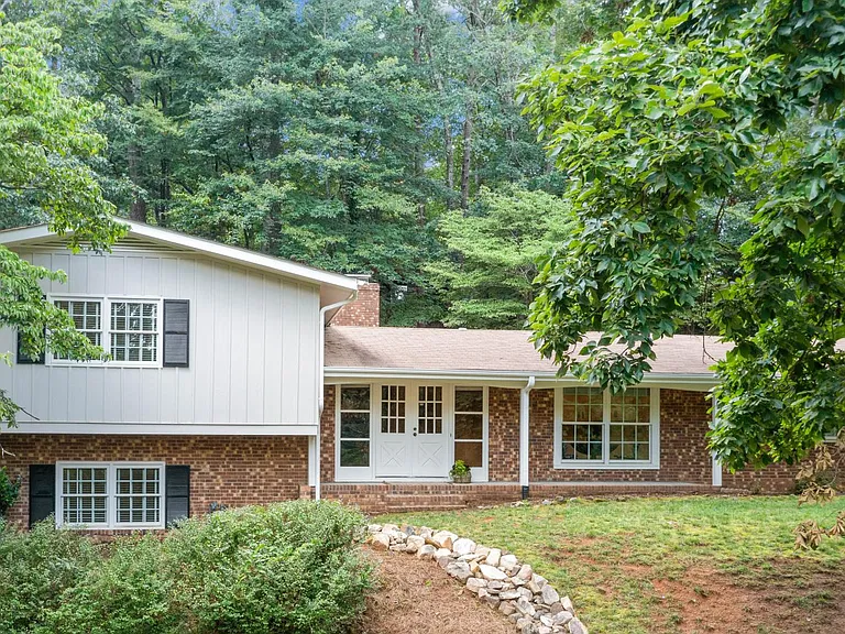 Main entrance and front patio, perfect for lake views in winter and forest views in summer!