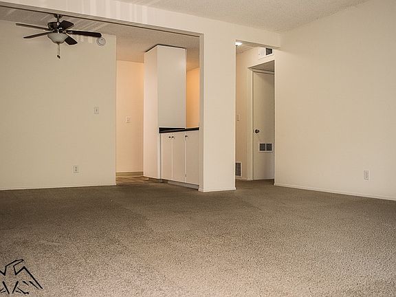 Large Dining Area Near Kitchen with Ceiling Fans