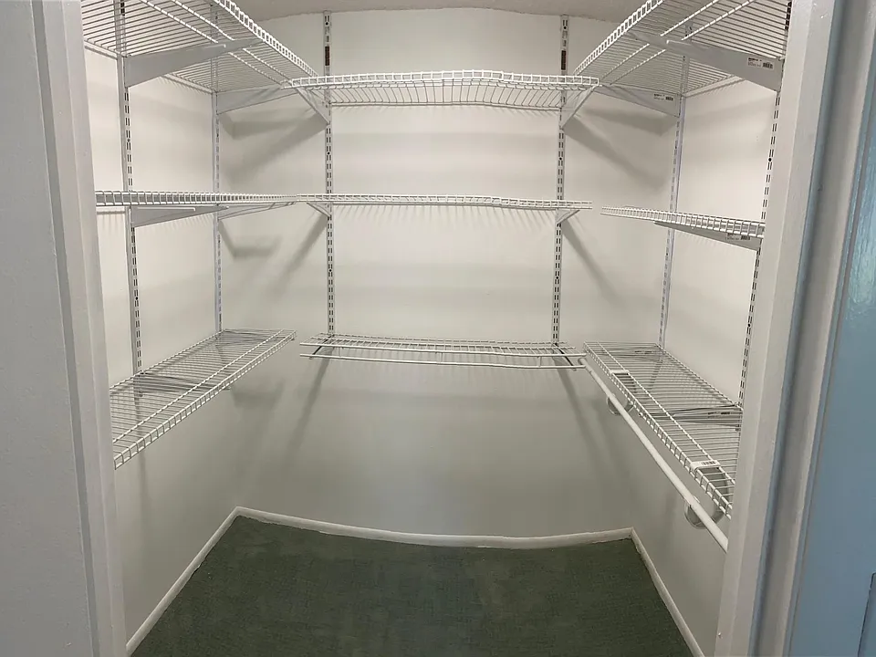 A spacious walk-in closet. in the master bedroom is functional and has plenty of room