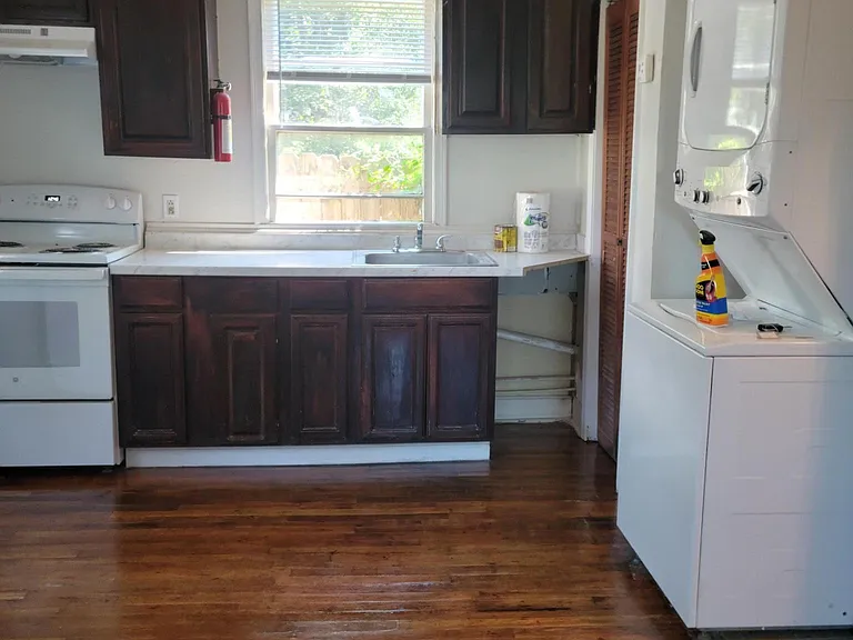 viewing from dinning room into kitchen & dinning room
