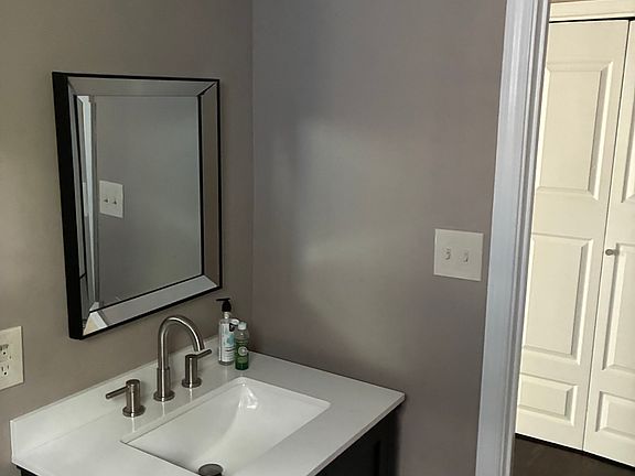 One half bath on first floor with newer sink and vanity.