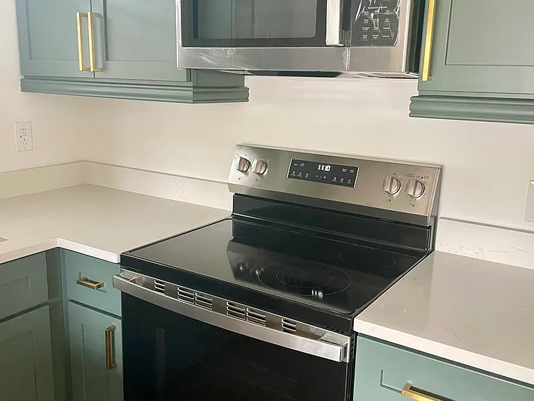 New, never-used appliances - oven and microwave (still has its new wrapping).