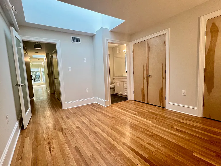En-suite bedroom showing door to hall (left) an door to bath (right).