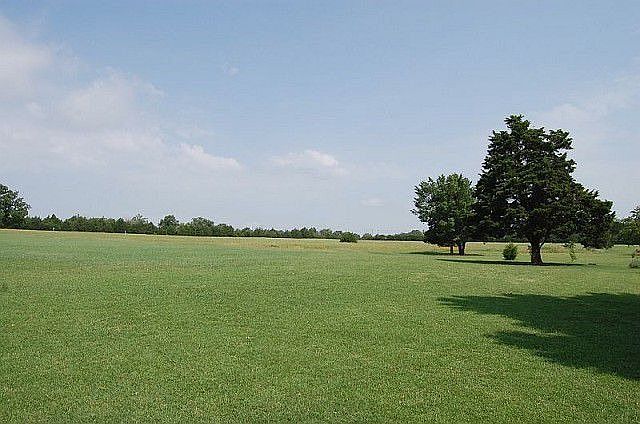 20 acre lot has trees, pond, creek and pasture