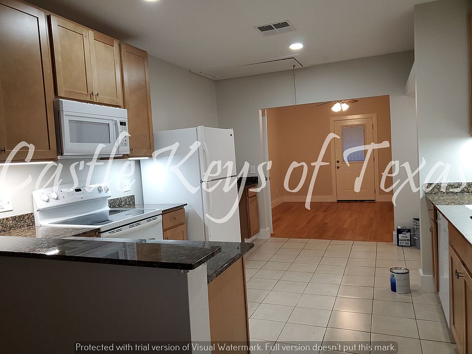 Nice large kitchen withgranite countertops and under-cabinet lighting.